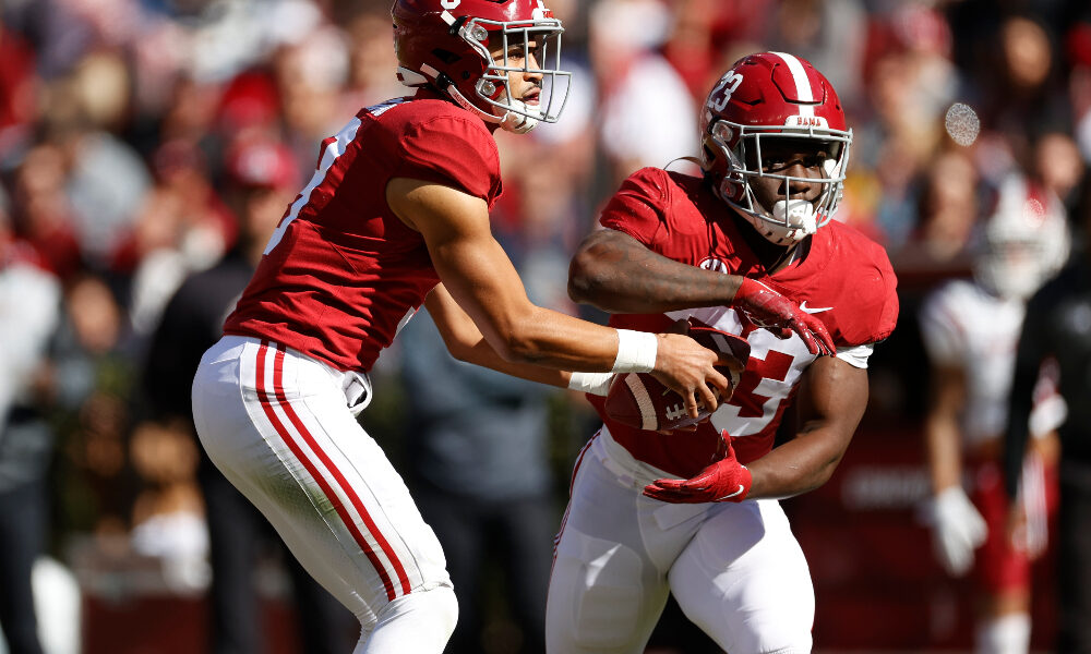 Roydell Williams gets a handoff from Bryce Young