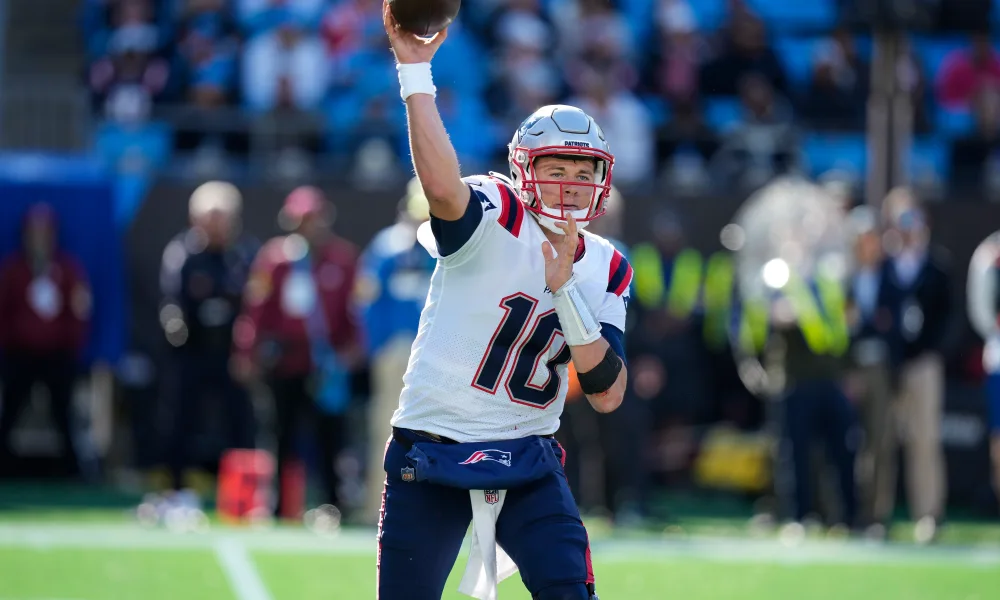 Mac Jones attempts a pass against the Panthers