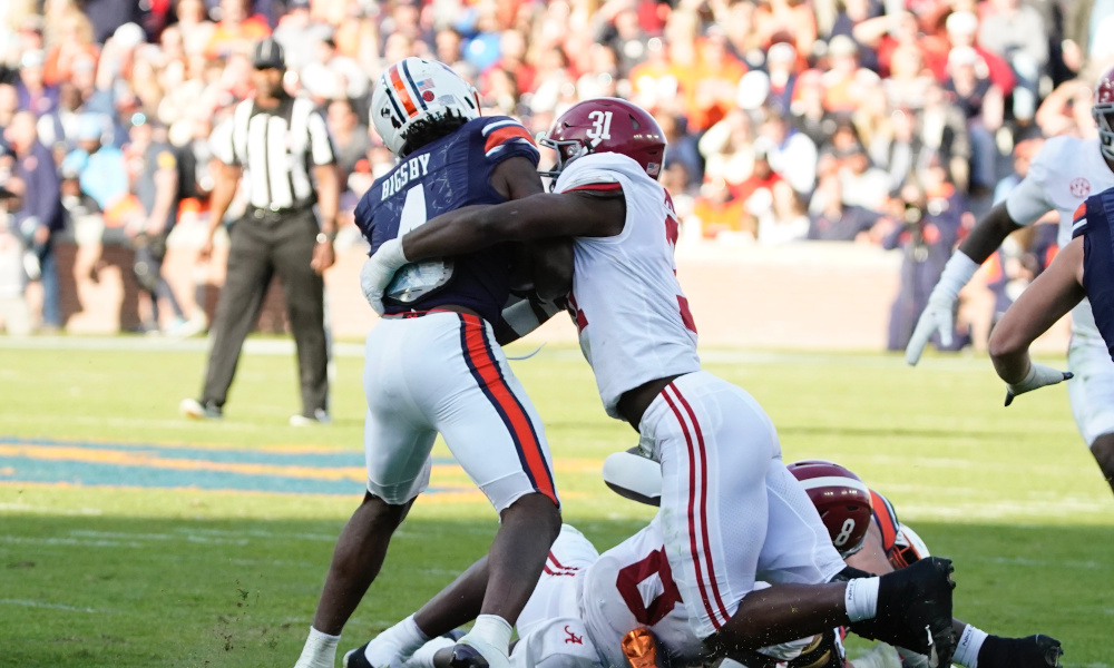 Will Anderson (#31) of Alabama tackles Auburn RB Tank Bigsby (#4) in 2021 Iron Bowl