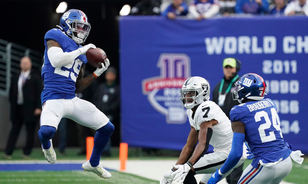 Xavier McKinney (#29) records an interception for Giants versus Raiders on Sunday