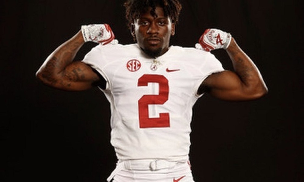 Aaron Anderson poses for picture in Alabama football uniform