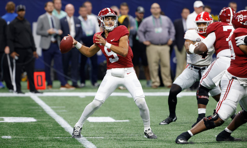 Bryce Young (#9) drops back to pass for Alabama in SEC Championship versus Georgia