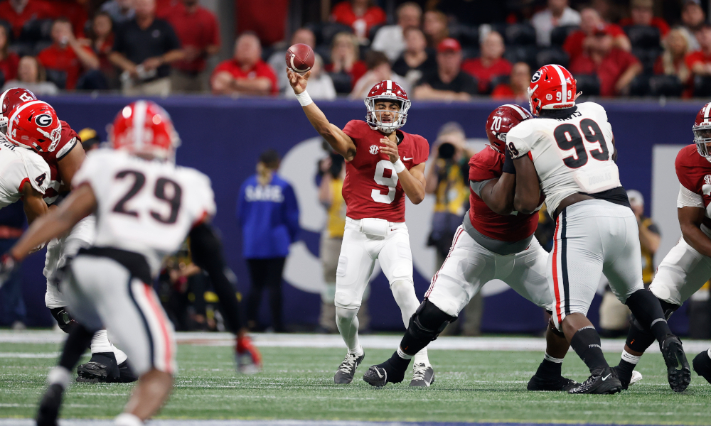 Bryce Young (#9) throws a pass for Alabama in SEC Championship Game versus Georgia