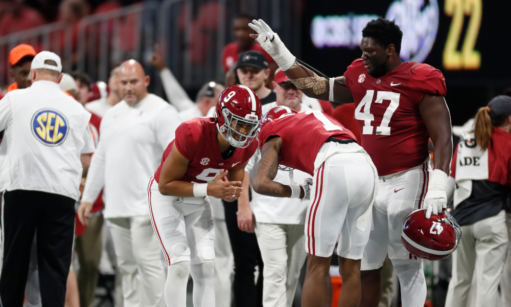 Bryce Young and Jameson Williams celebrate a touchdown for Alabama versus Georgia in 2021 SEC Championship