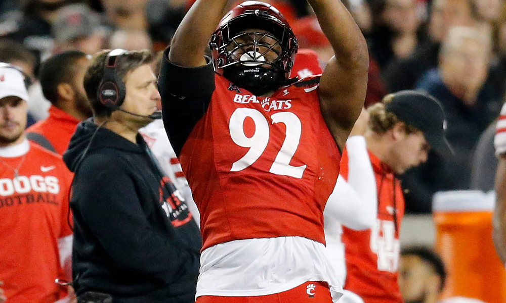 Curtis Brooks (#92) celebrates a play for Cincinnati in 2021 AAC Championship Game versus Houston