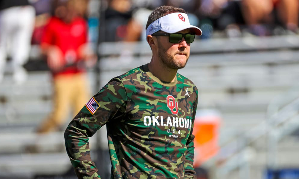 Lincoln Riley on the field for Oklahoma before a matchup in 2021 season