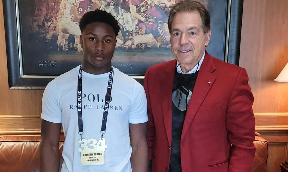 Anthony Rodgers takes picture with Saban during visit