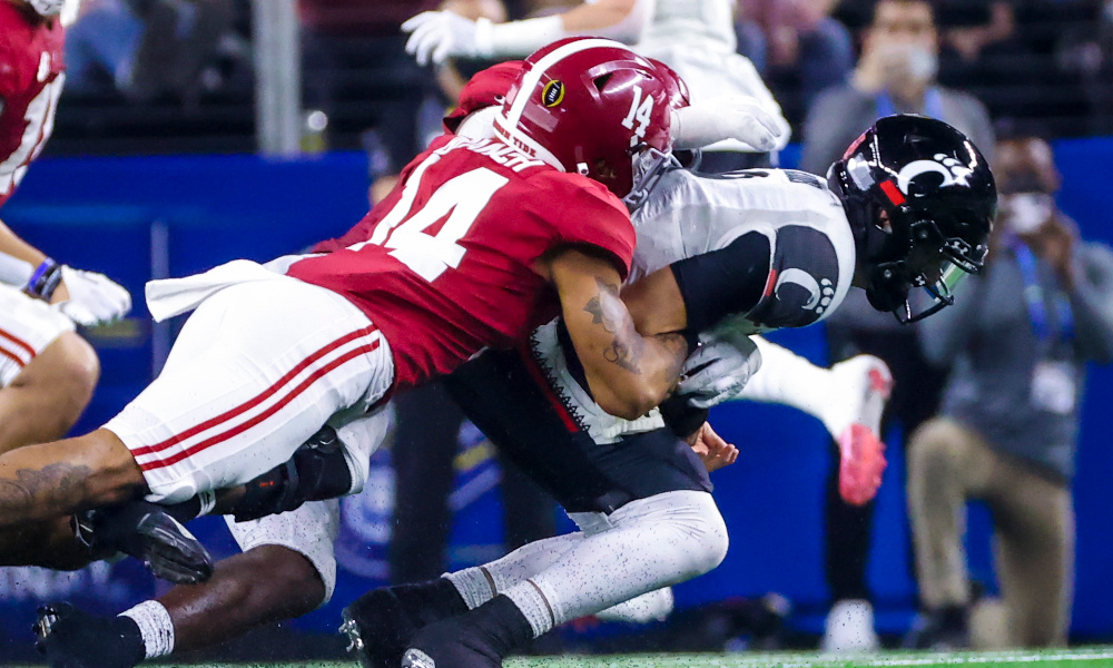 Brian Branch (#14) of Alabama sacks Desmond Ridder (#9) of Cincinnati in 2021 Cotton Bowl Classic