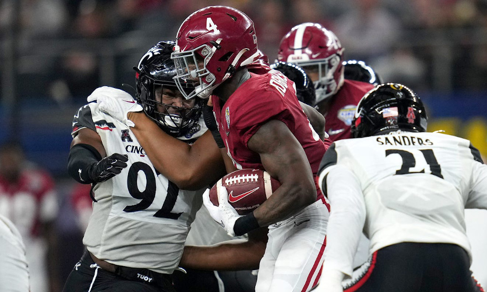 Brian Robinson (#4) breaking tackles for Alabama versus Cincinnati in 2021 Cotton Bowl