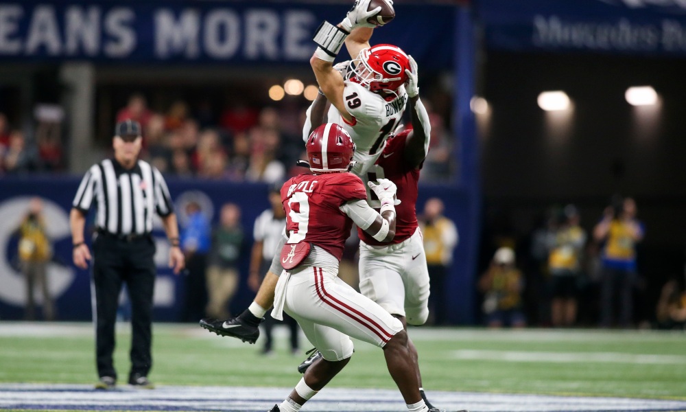 Brock Bowers (#19) with a catch for Georgia in double coverage versus Alabama in 2021 SEC Championship Game