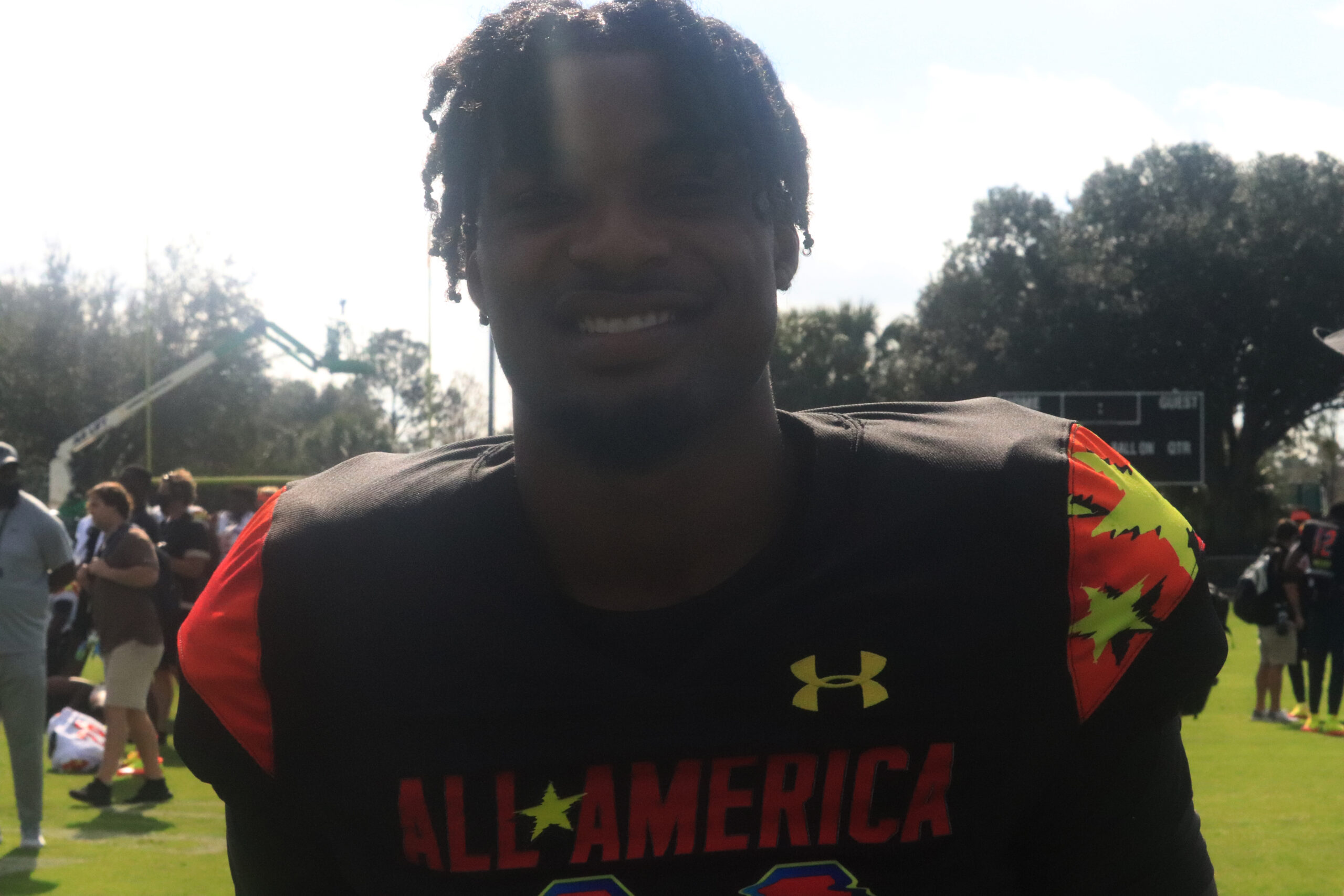 shazz Preston poses for picture at under armour game