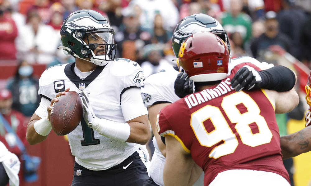 Jalen Hurts (#1) attempts a pass for Eagles in 2022 game versus Washington