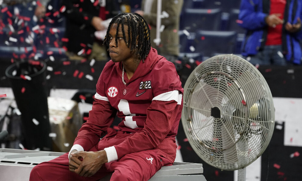 Jameson Williams sits on the bench following national championship loss