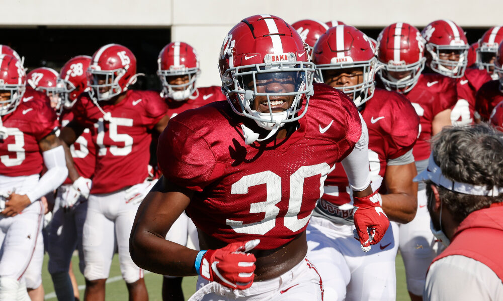 King Mwikuta runs through a drill in practice