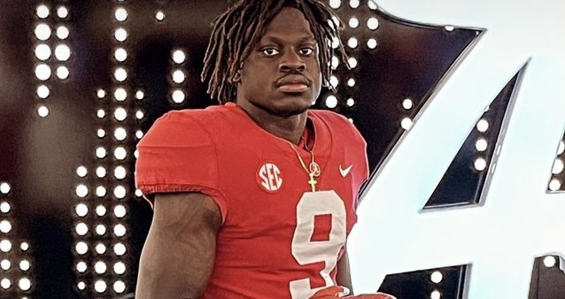 Richard Young poses in Alabama uniform