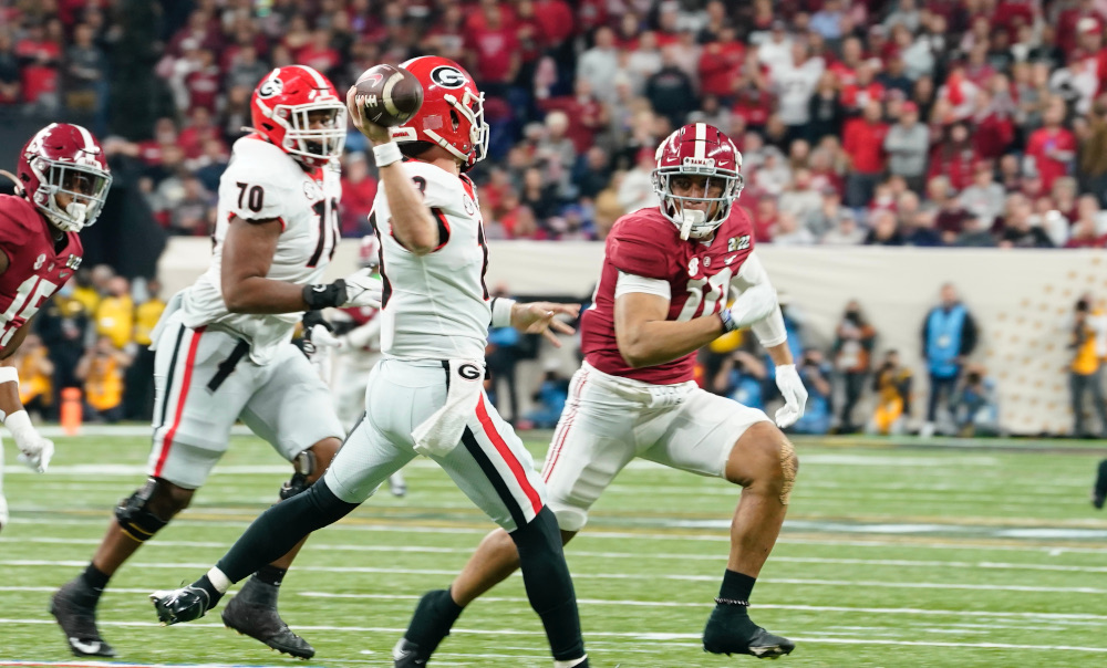 Stetson Bennett (#13) fires a pass for Georgia in CFP National Championship against Alabama