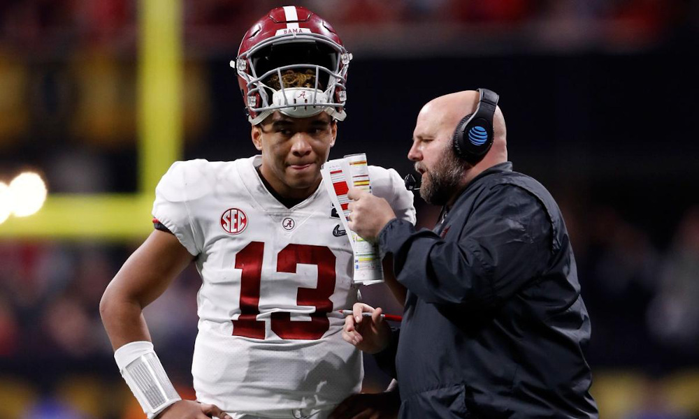 Brian Daboll and Tua Tagovailoa discussing a play for Alabama during a timeout in 2018 CFP National Championship Game