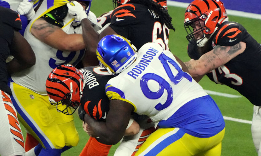 A'Shawn Robinson (#94) of the Los Angeles Rams sacks Bengals' QB Joe Burrow in Super Bowl 56