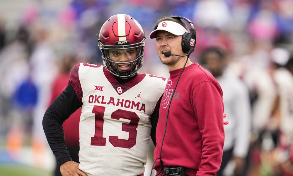 Caleb Williams (#13) on the sideline with Lincoln Riley of Oklahoma for 2021 season