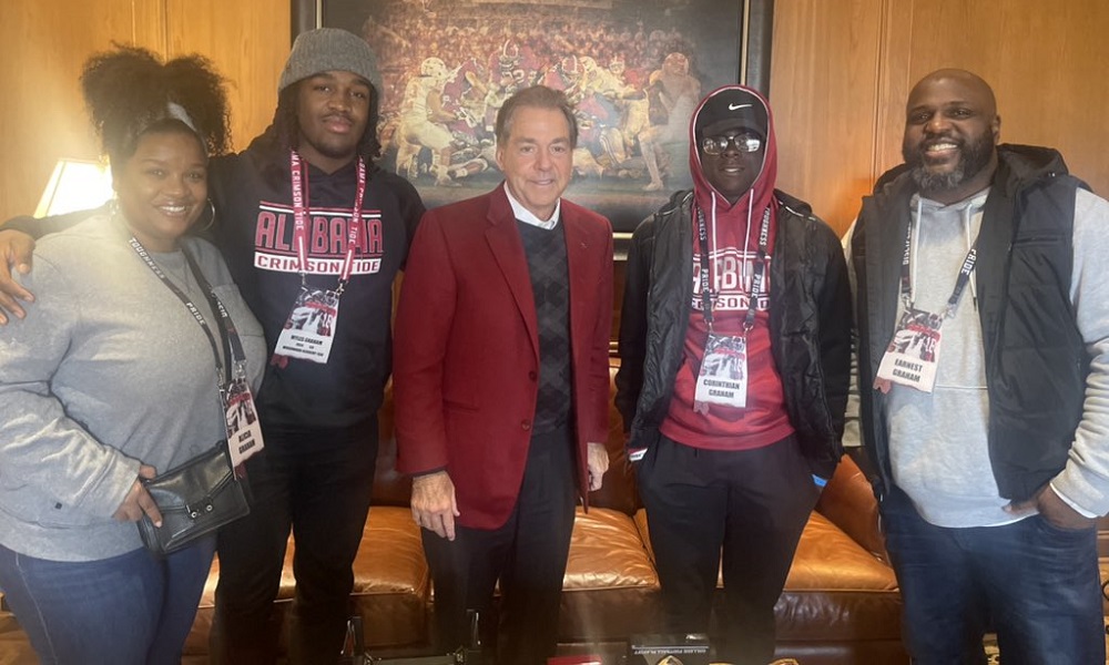Myles Graham and family with Saban during viist