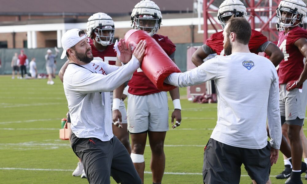 Alabama OLBs coach Coleman Hutzler demonstrating a drill in 2022 spring practice