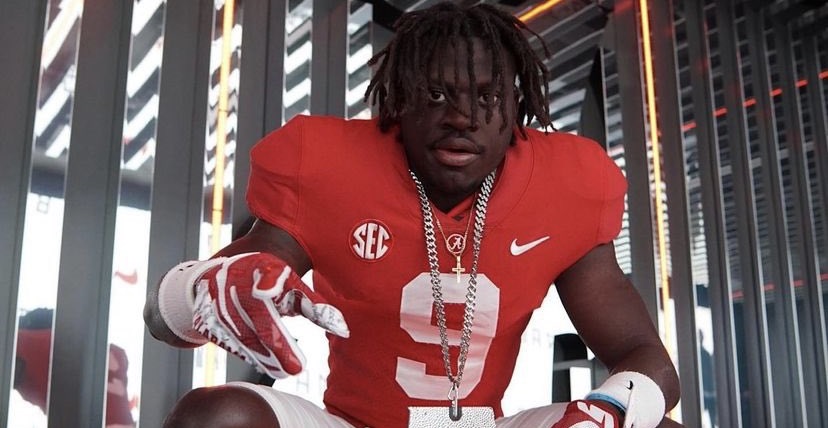 Richard Young poses in Alabama uniform and bama chain