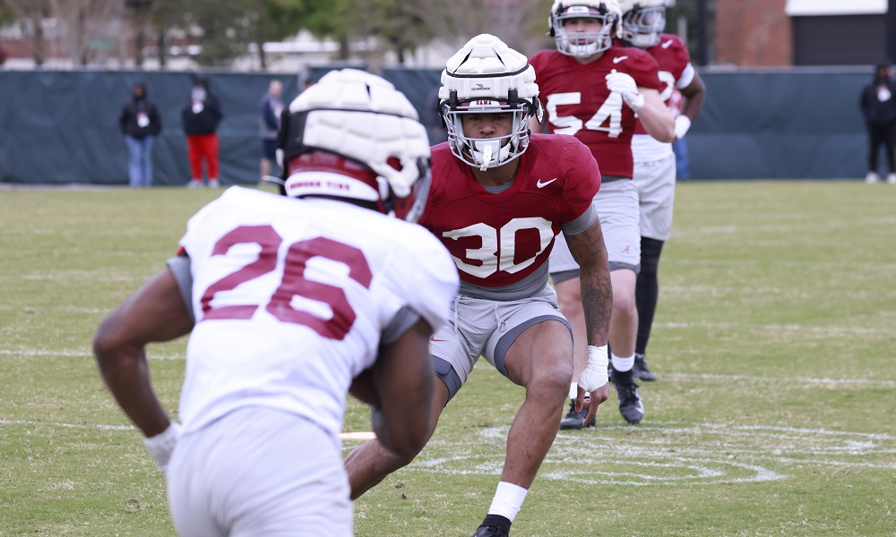 Alabama LB Jihaad Campbell (#30) closing in to tackle RB Jamarion Miller (#26) in 2022 Spring Practice