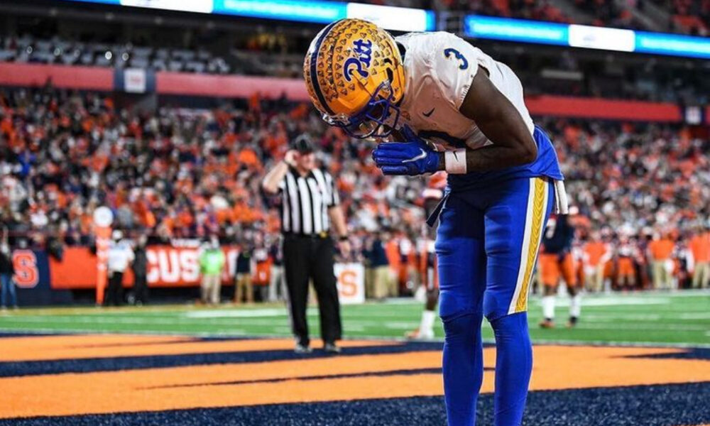 Pitt receiver Jordan Addison bows after scoring a TD