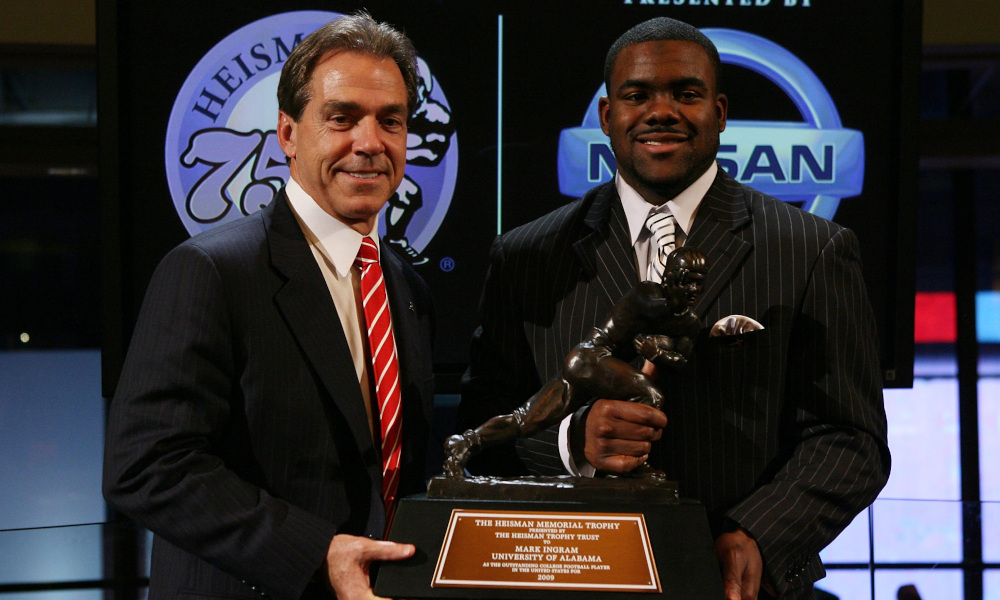 Nick Saban and Mark Ingram posing with the Heisman Memorial Trophy at the 2009 presentation
