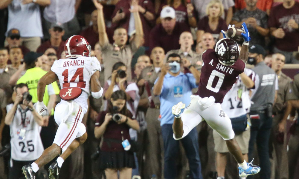 Texas A&M WR Ainias Smith (#0) with a catch versus Alabama DB Brian Branch in 2021 matchup