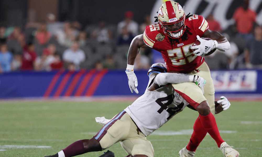 Bo Scarbrough (#25) runs with the ball for the Birmingham Stallions versus Michigan Panthers in USFL matchup