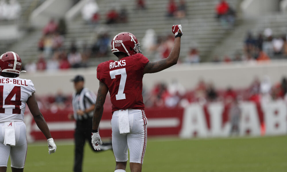 Eli Ricks signals to the sidelines during A-Day