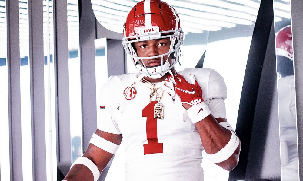 Malik Bryant posing in Alabama uniform durig visit