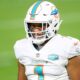 Tua Tagovailoa (#1) on the field for the Dolphins in 2021 regular season game