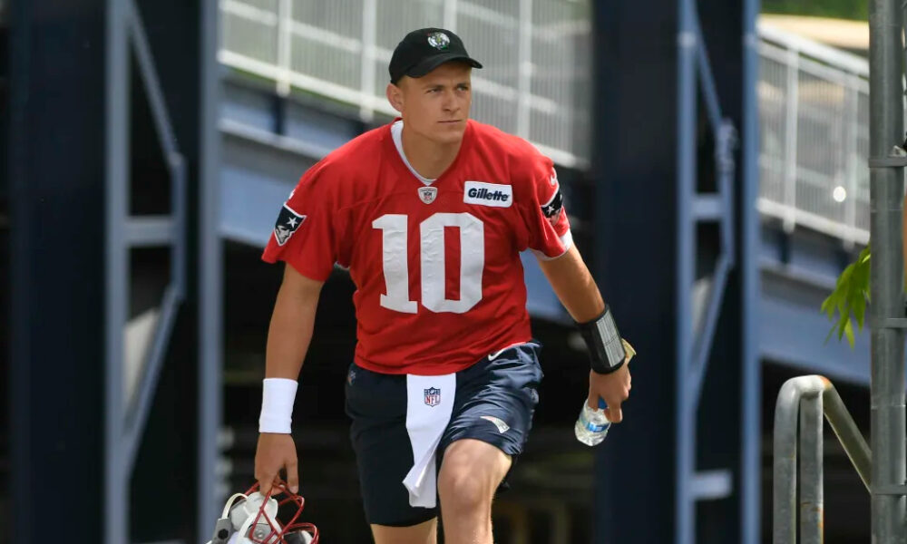 Mac Jones walks onto the practice field