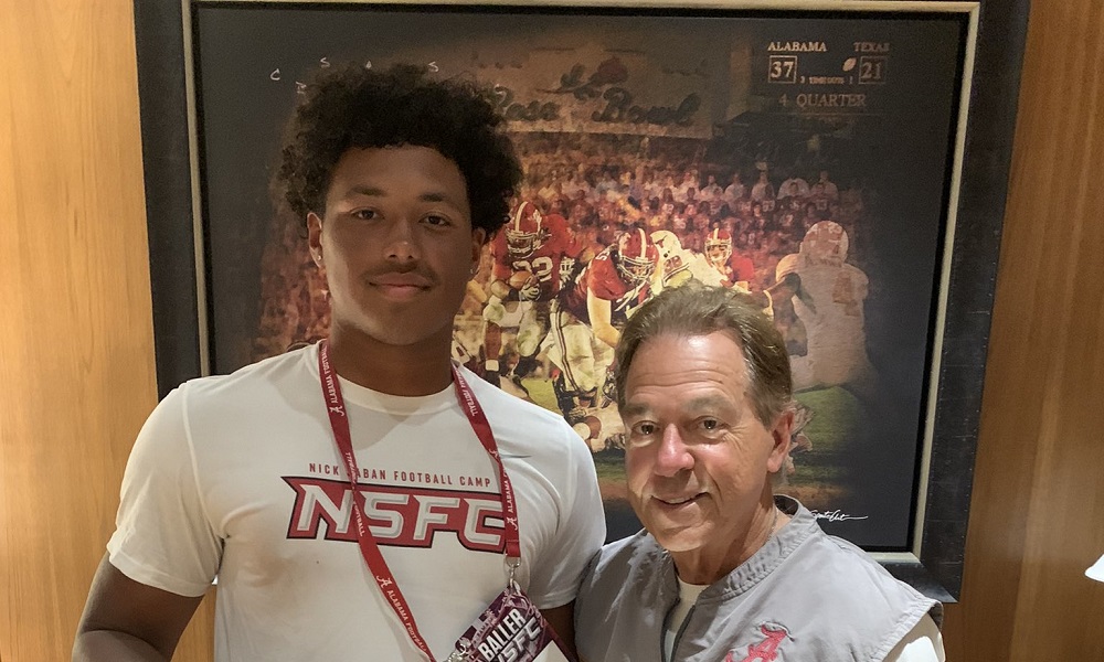Nick saban and Daevin Hobbs poses for picture after he earned alabama offer