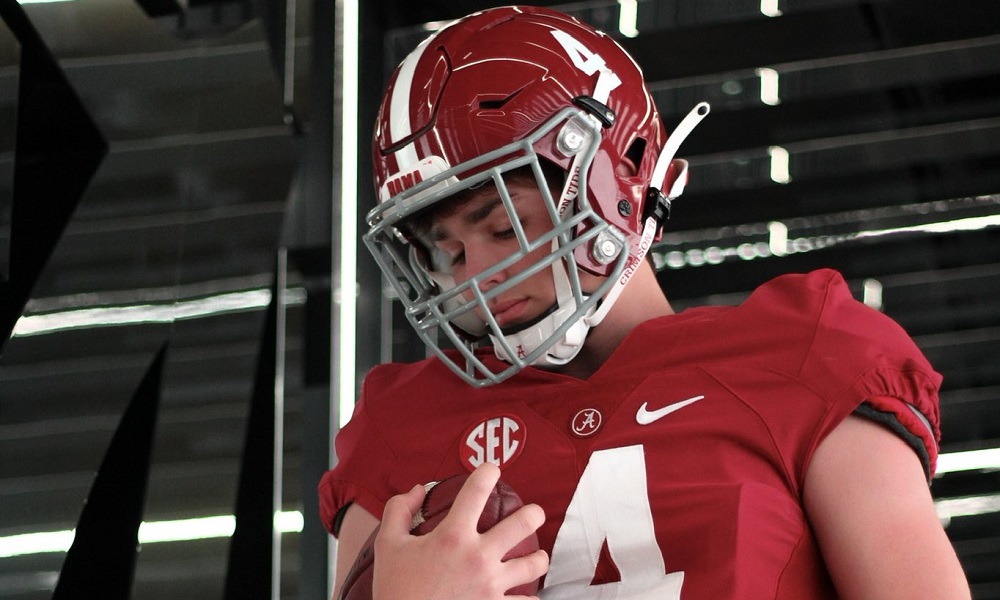 Peyton Woodring holds football during alabama visit