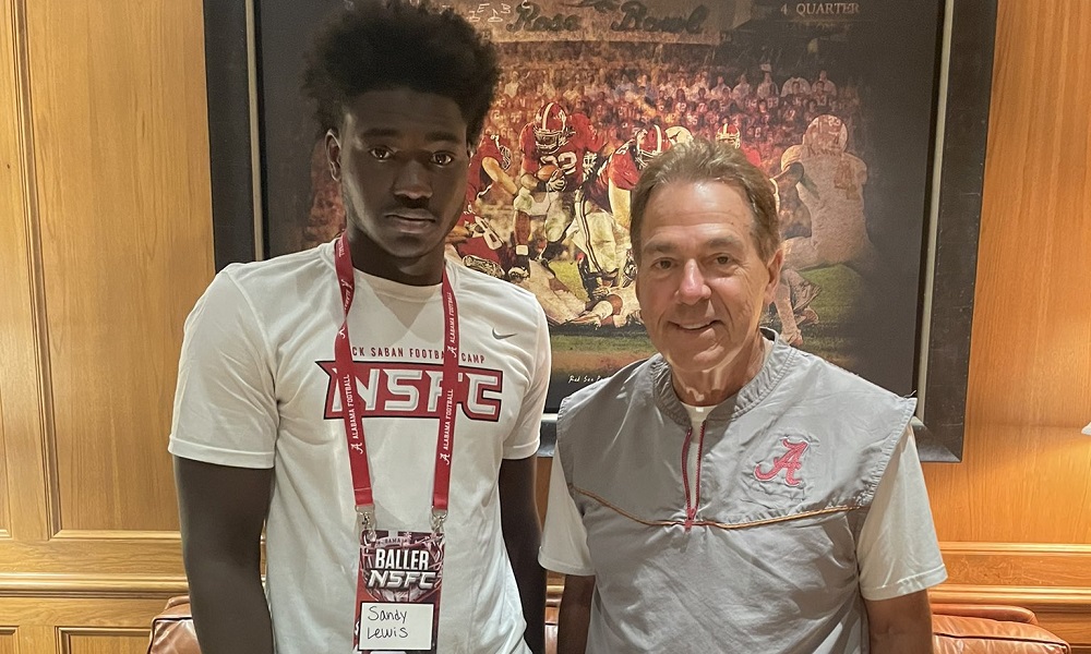 Sandy Lewis and Nick Saban after football camp at alabama