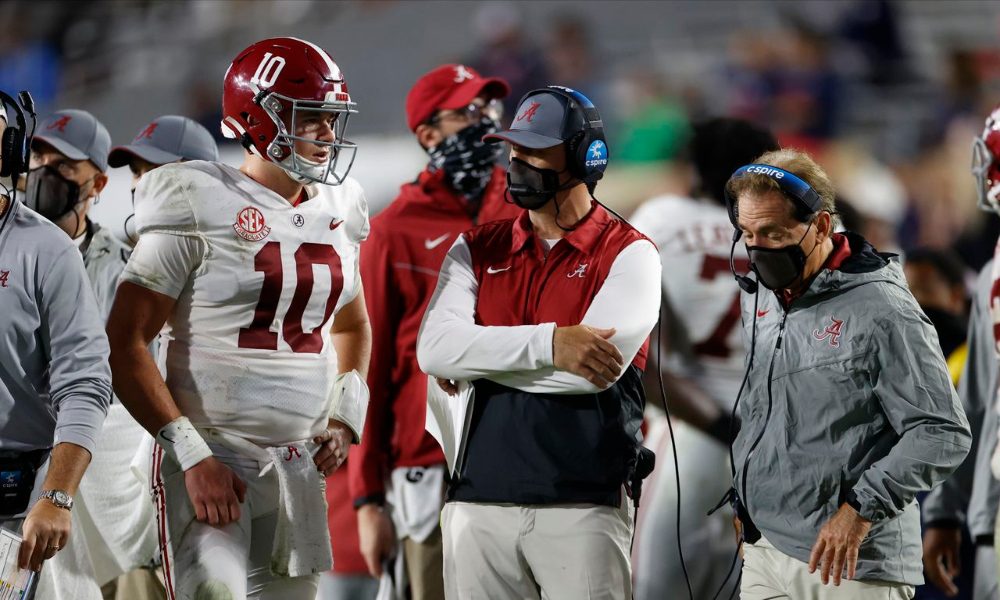 Steve Sarkisian and Nick Saban talk to Mac Jones