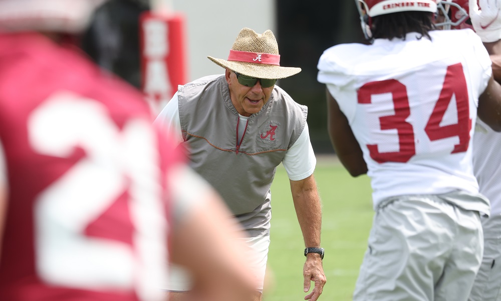 Nick Saban coaching players through drills in Alabama's first practice of 2022 fall camp