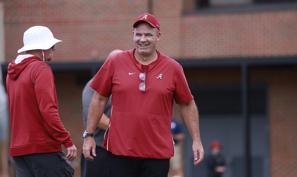 Bill O'Brien smiles while going through practice