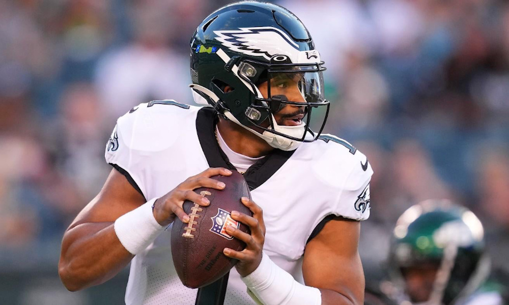 Jalen Hurts (#1) attempts a pass for Eagles in 2022 NFL preseason game versus Jets