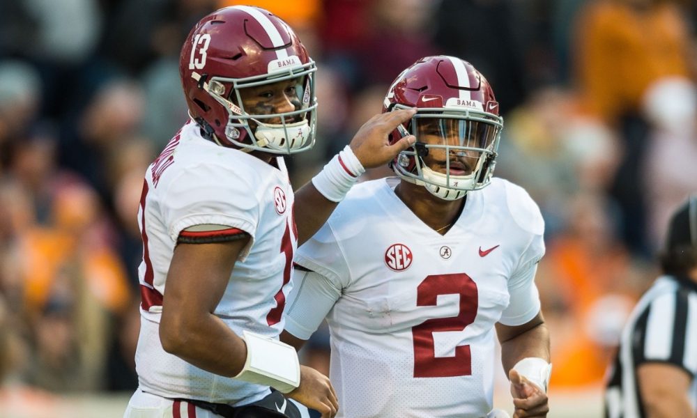 Jalen Hurts and Tua Tagovailoa celebrate a score against Tennessee