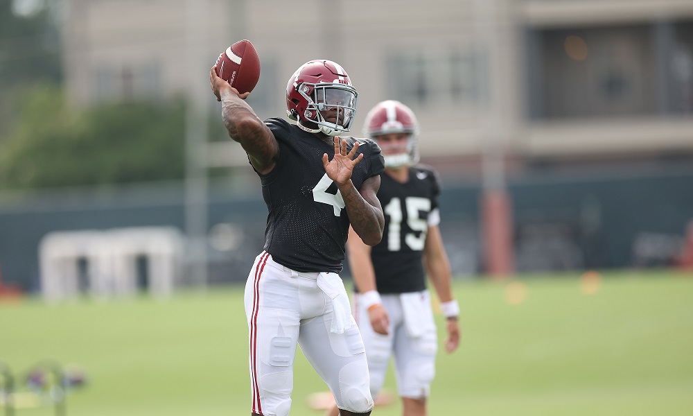 Alabama QB Jalen Milroe (#4) attempting a pass in practice