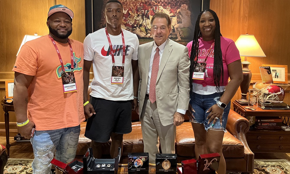 Arion carter and family with nick saban during alabama visit