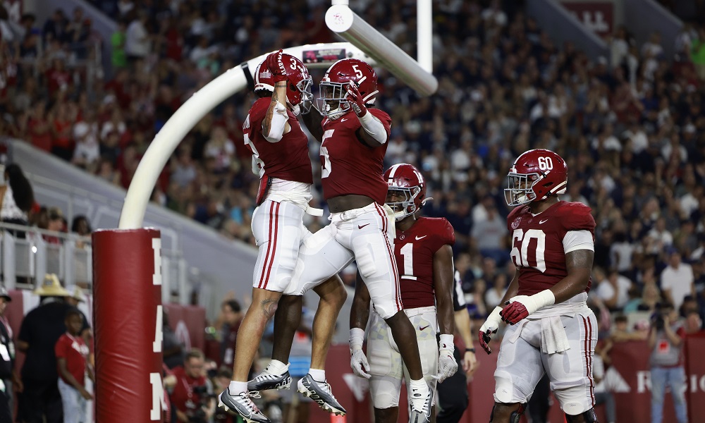 Alabama RB Roydell Williams (#5) celebrates a touchdown with Jermaine Burton against Utah State