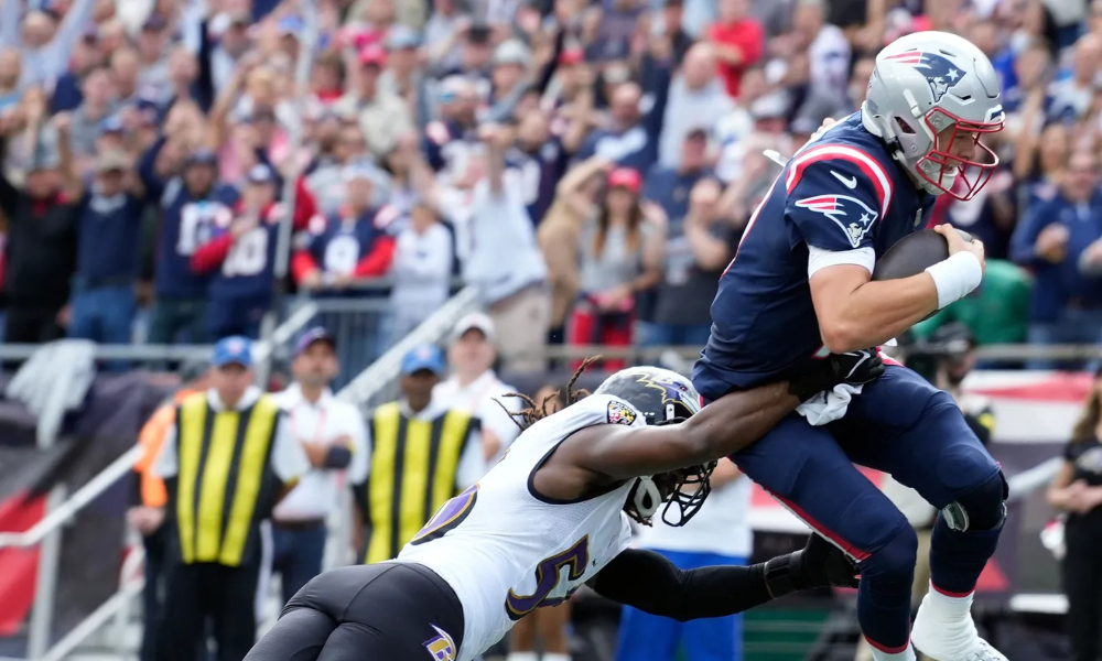 Mac Jones takes a hit from the Ravens