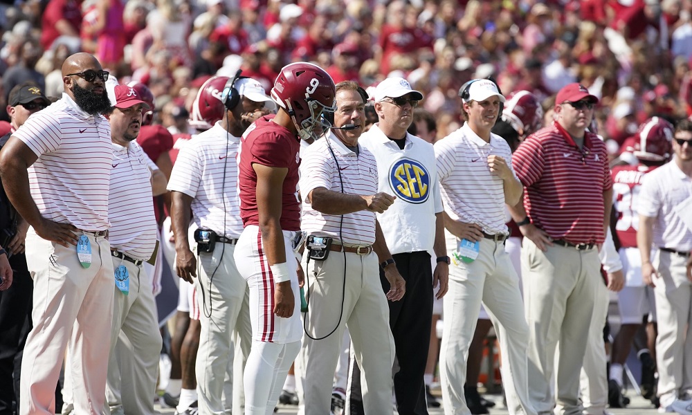 Nick saban talking to bryce young during ulm game