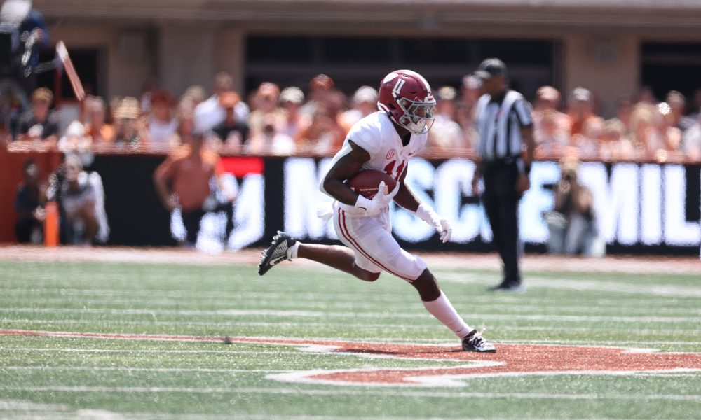 Traeshon Holden runs with the football against Texas