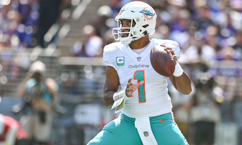 Tua Tagovailoa (#1) drops back to pass for Dolphins versus Ravens